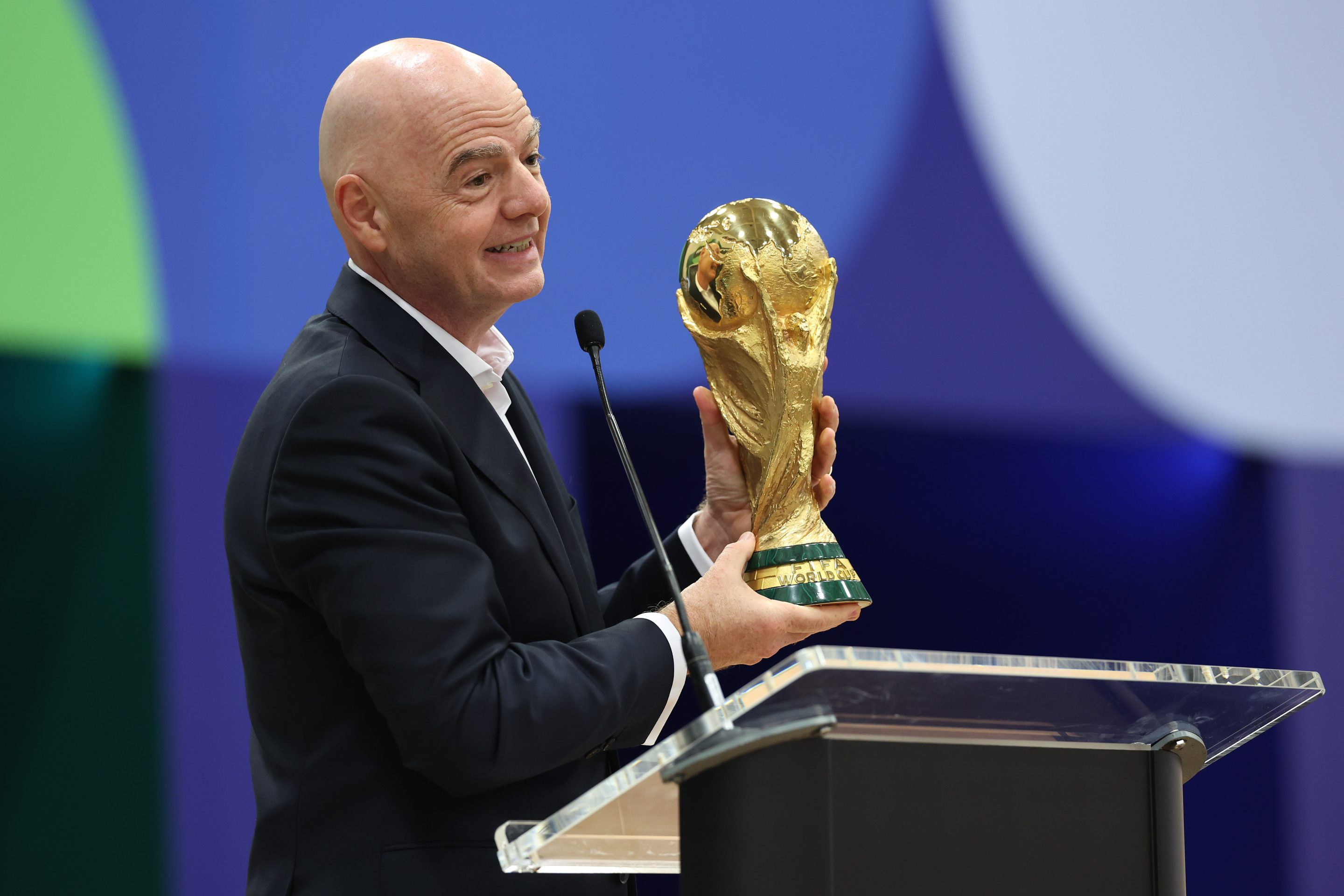 FIFA President Gianni Infantino holds the World Cup trophy. The tournament begins on June 11 with the first U.S. match on June 12.