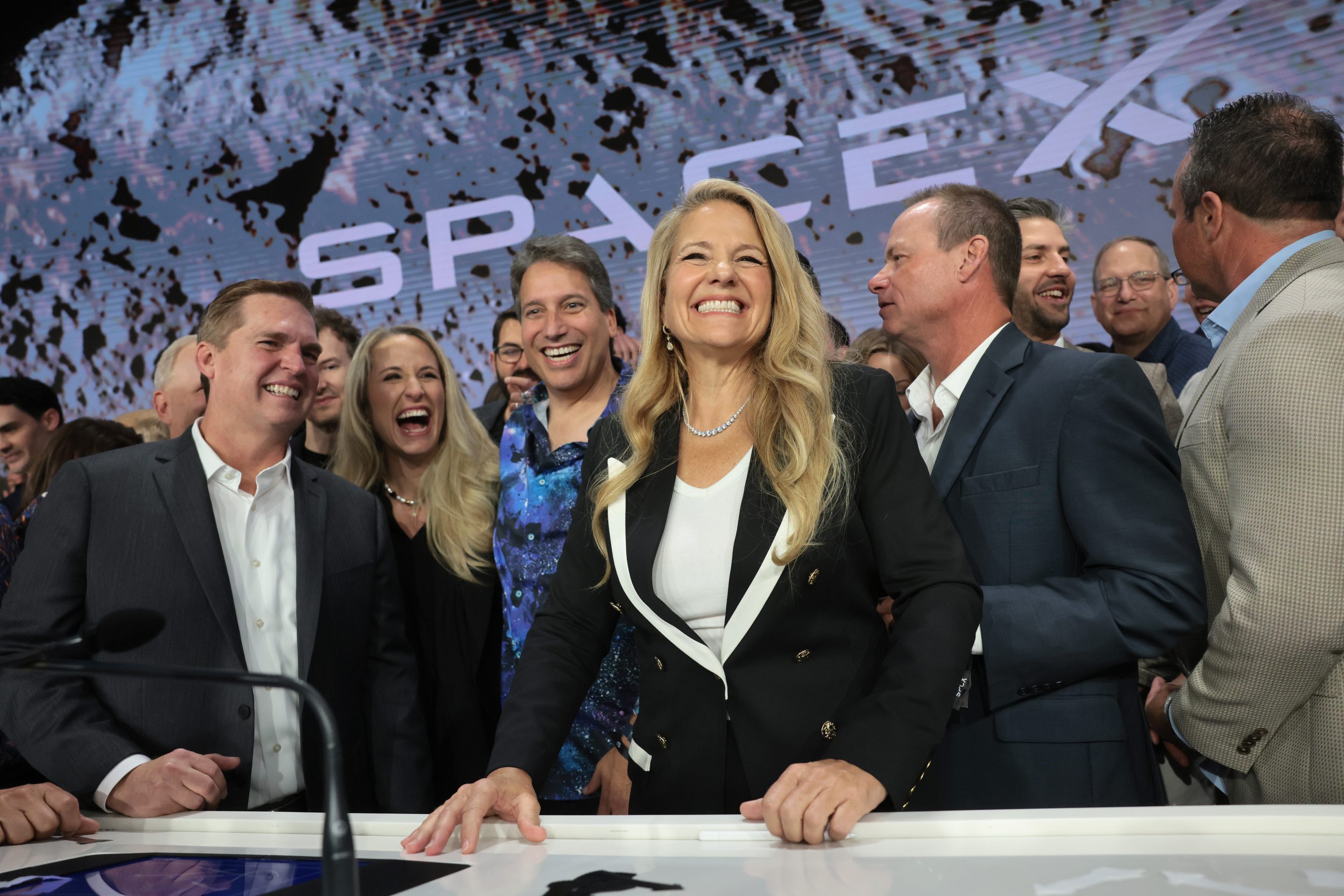 Shotwell stands and smiles widely