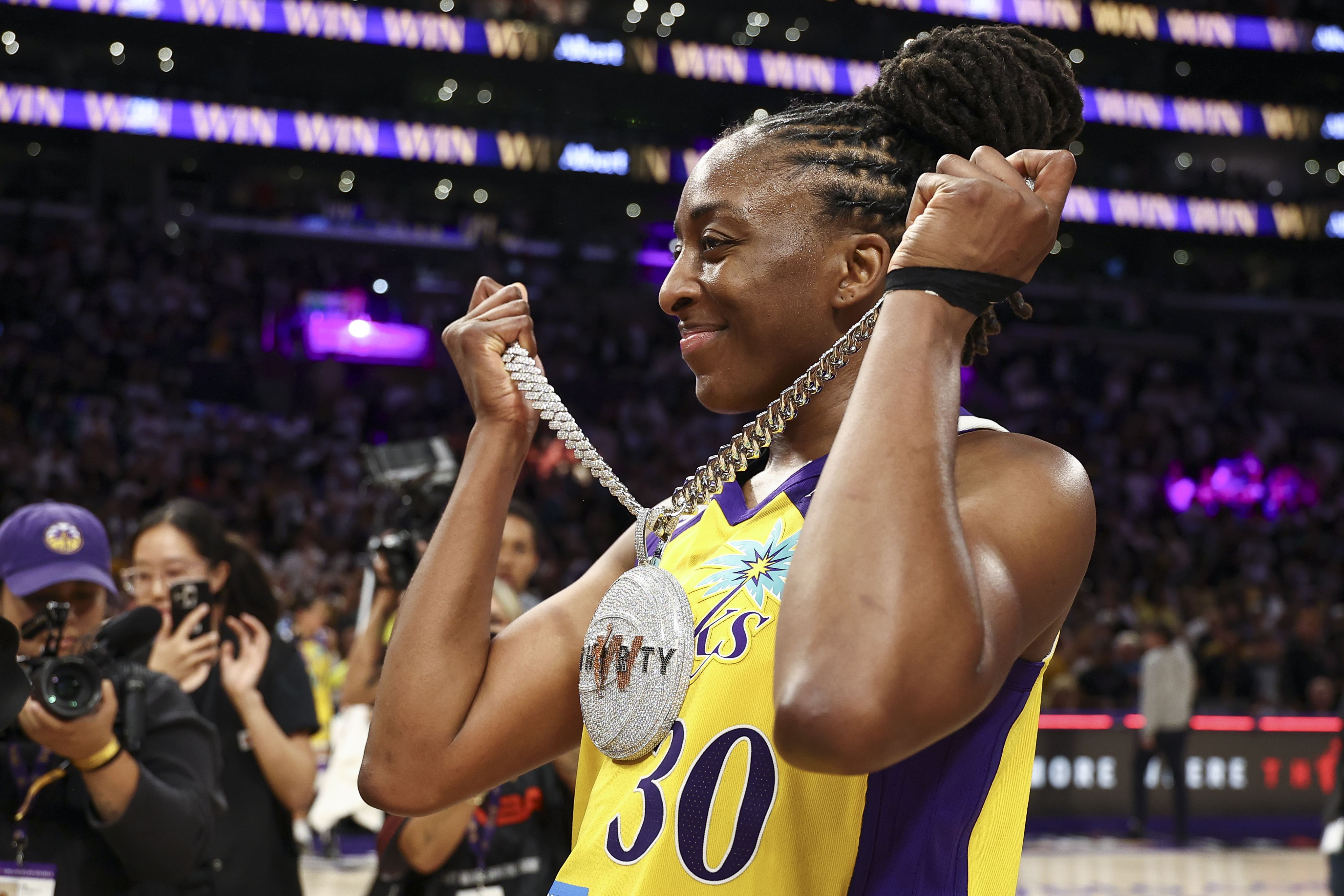 Nneka Ogwumike #30 of the Los Angeles Sparks celebrates after the WNBA's 30th anniversary game against the New York Liberty.