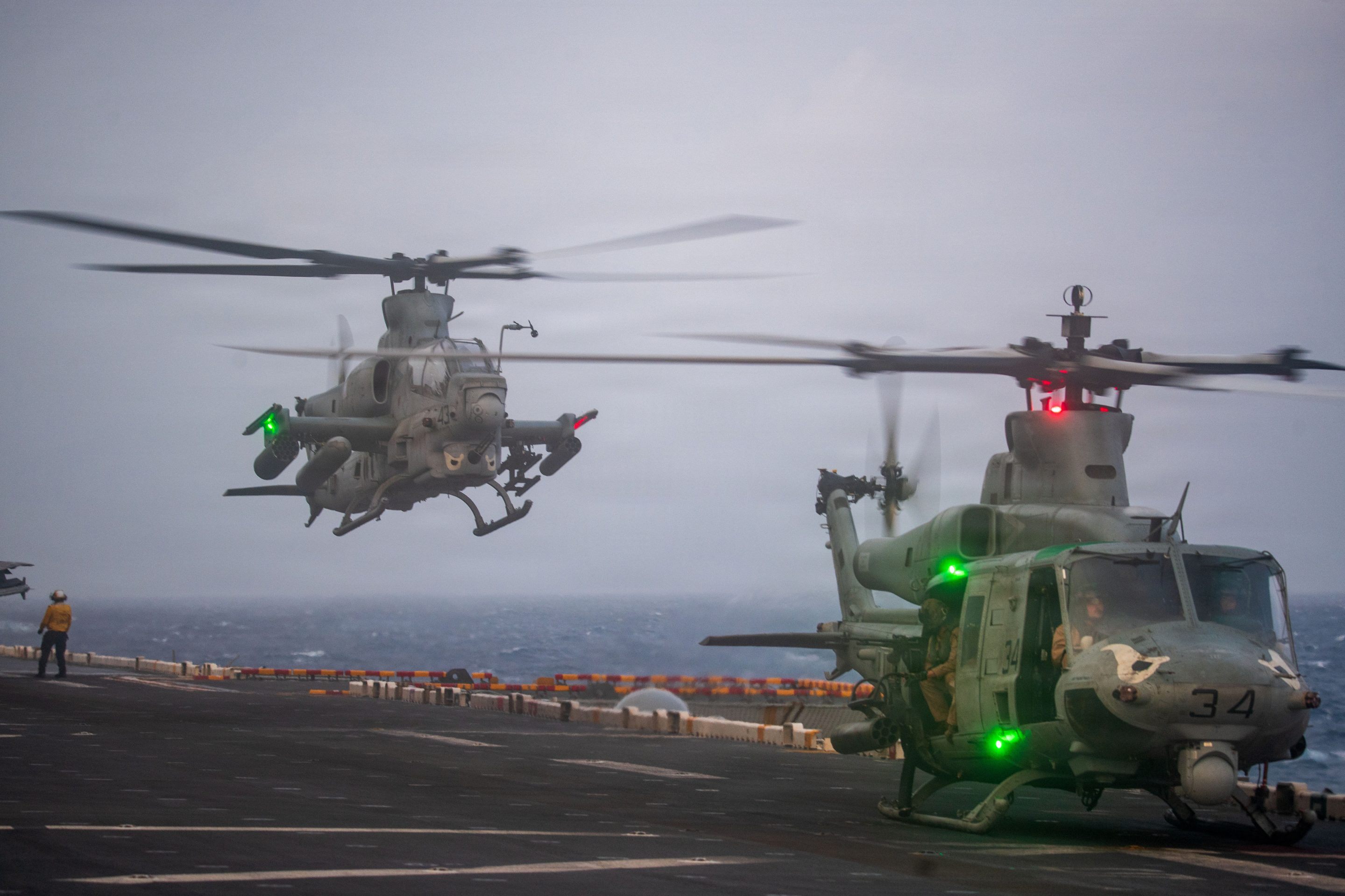 U.S. Marine Corps UH-1Y Venom and AH-1Z Viper, assigned to Marine Medium Tiltrotor (VMM) 163 (Reinforced), 11th Marine Expeditionary Unit (MEU), conduct flight operations of the flight deck of Wasp-class amphibious assault ship USS Boxer (LHD 4), July 1, 2026.