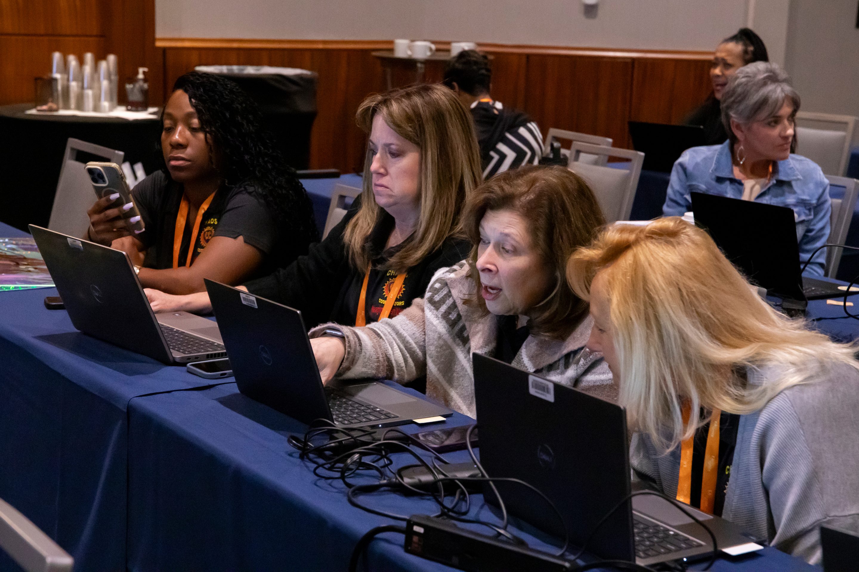 From left, Raytheon administrators Marianna Leonard, Holly Martineau, Lynn Ljunggren and Annemarie Downing workshop an AI exercise during "How To Use AI To Think and Influence at the Executive Level," an administrative training session, Wednesday, April 22, 2026, in Boston.