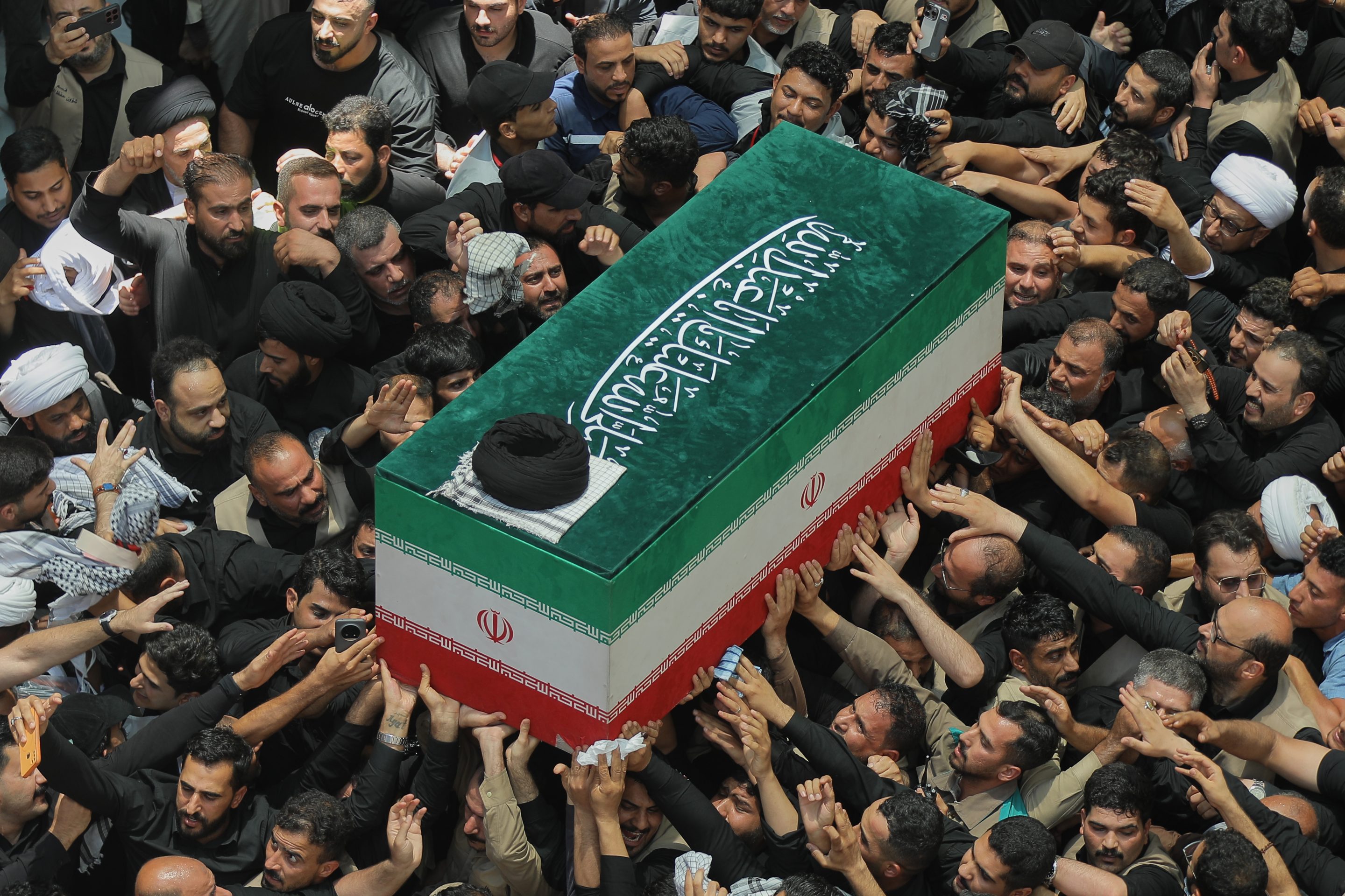 The coffin of the late Iranian Supreme Leader Ayatollah Ali Khamenei is carried by mourners to the Imam Ali Shrine in Najaf, Iraq, Wednesday, July 8, 2026.