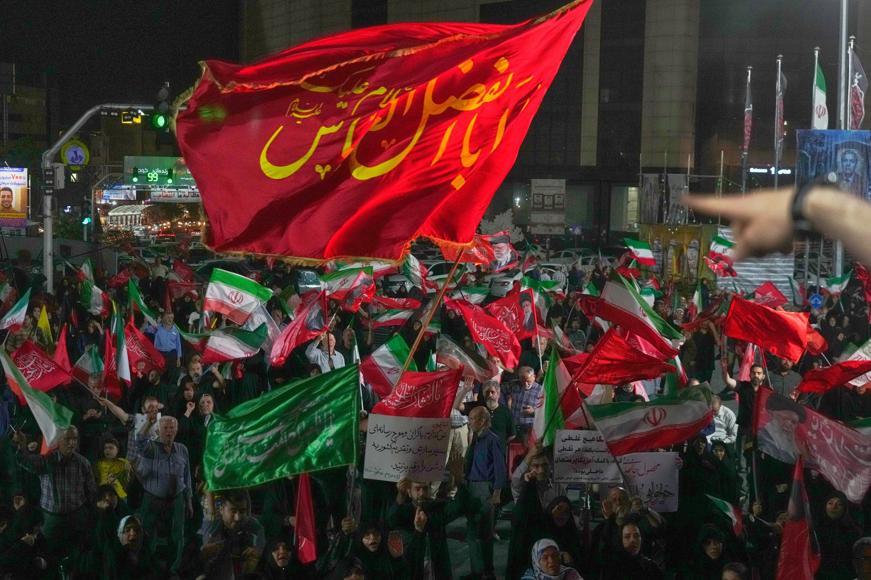 Pro-government demonstrators gather at a square in Tehran, Friday, July 17, 2026.