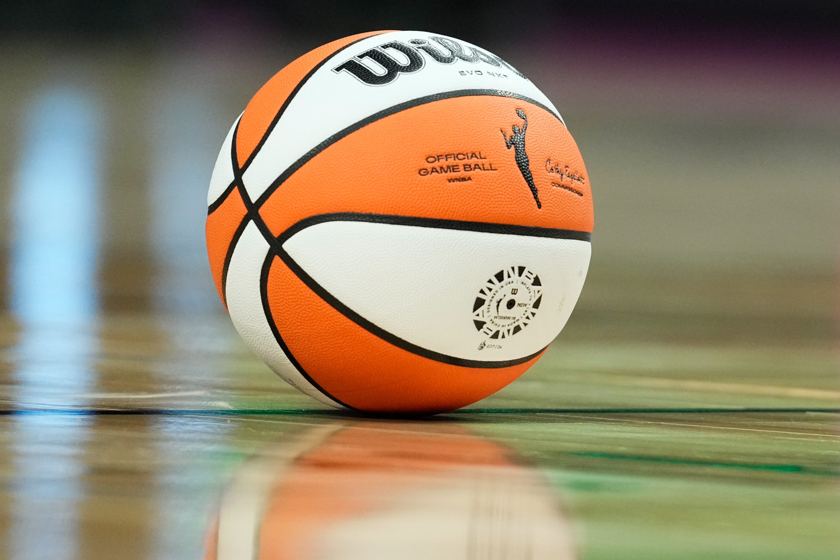 FILE - The official game ball rests on the court during a time out in the second half of a WNBA basketball game between the Portland Fire and the Chicago Sky, May 9, 2026, in Portland, Ore. 