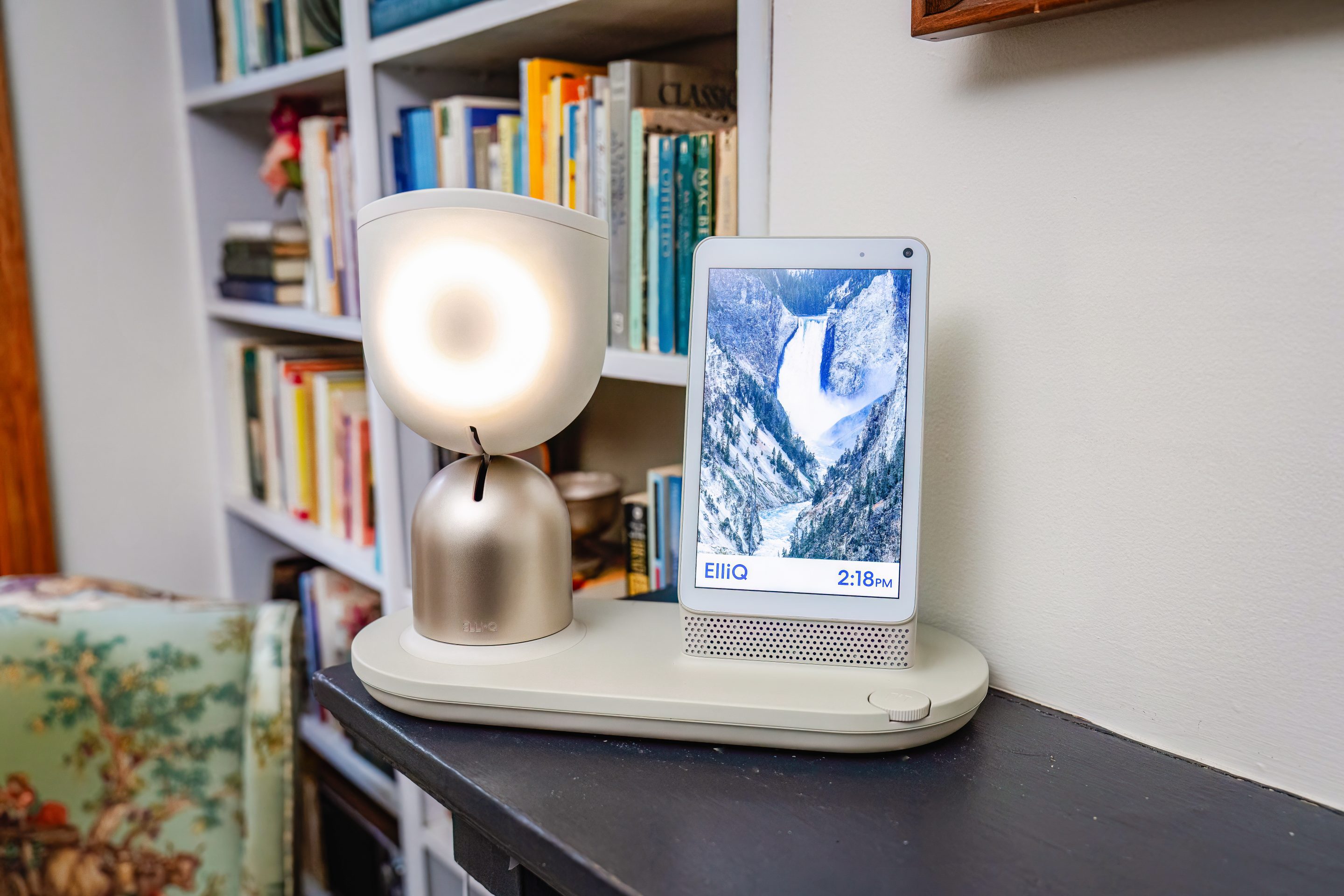 Photo of the ElliQ device in a living room