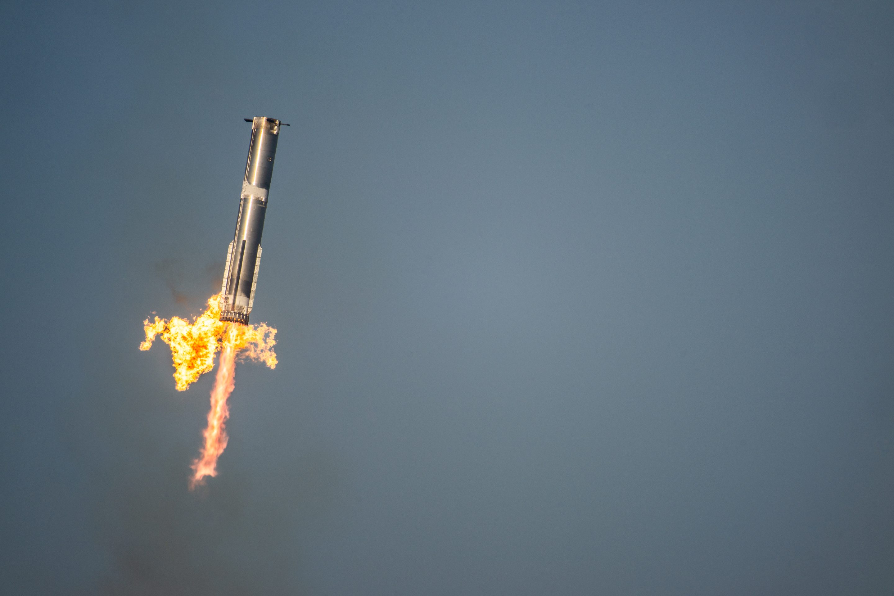 The SpaceX Starship Flight 8 booster returns returns from its ascent at Boca Chica beach on March 6, 2025 in Boca Chica Beach, Texas. 