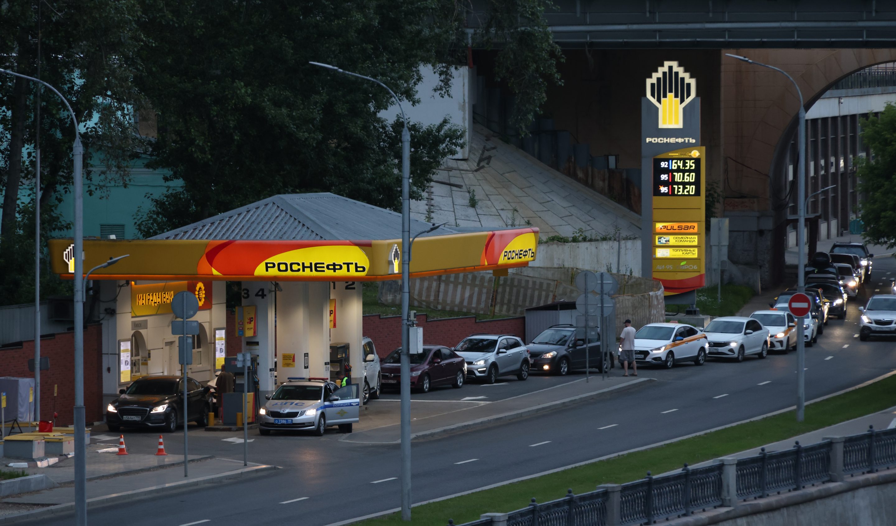 Cars queue at a gas station operated by Rosneft, a state-controlled Russian oil company, on June 27, 2026, in Moscow, Russia.