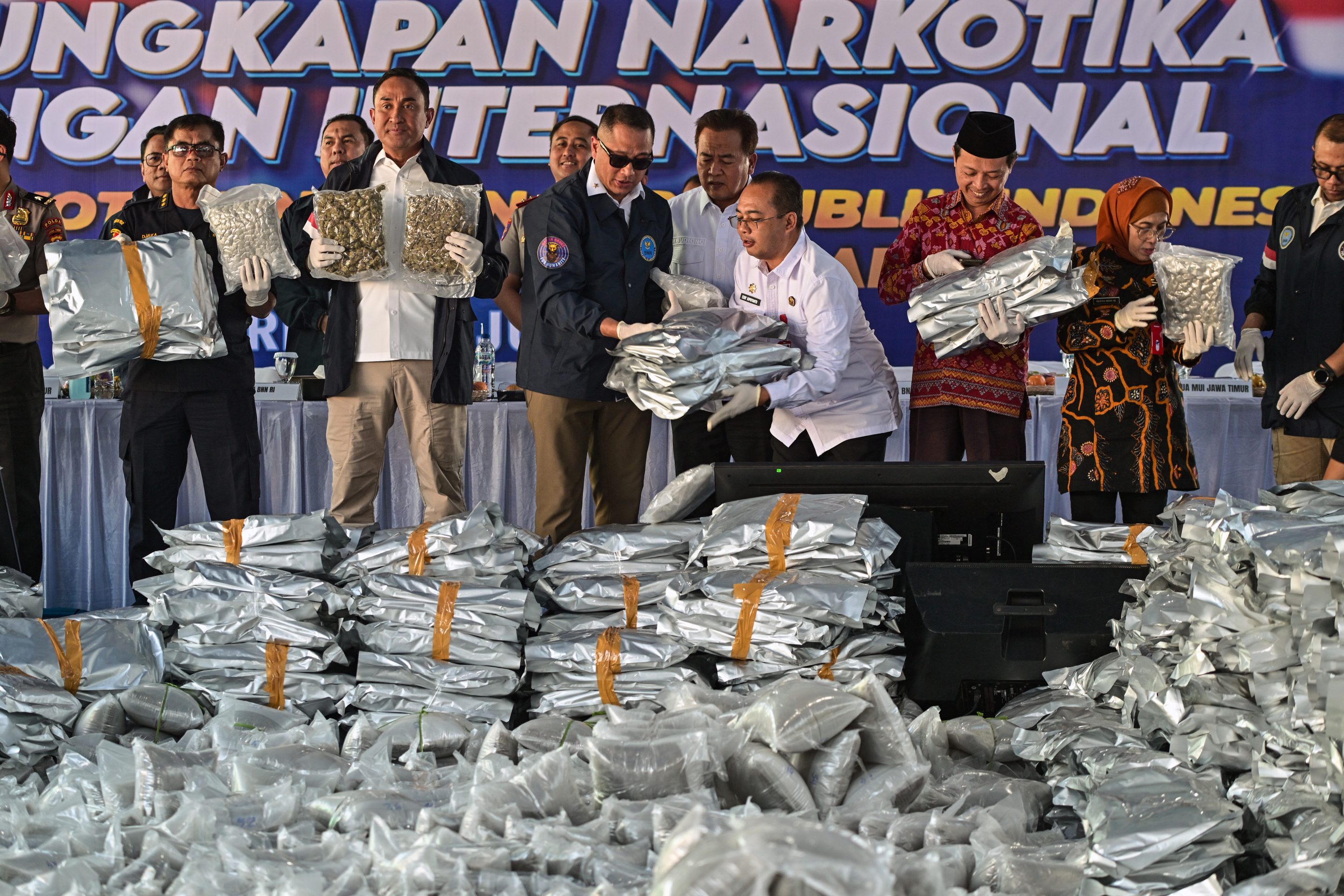 Customs officers display cannabis seized after Indonesian authorities intercepted 3.37 metric tons allegedly smuggled from Thailand.