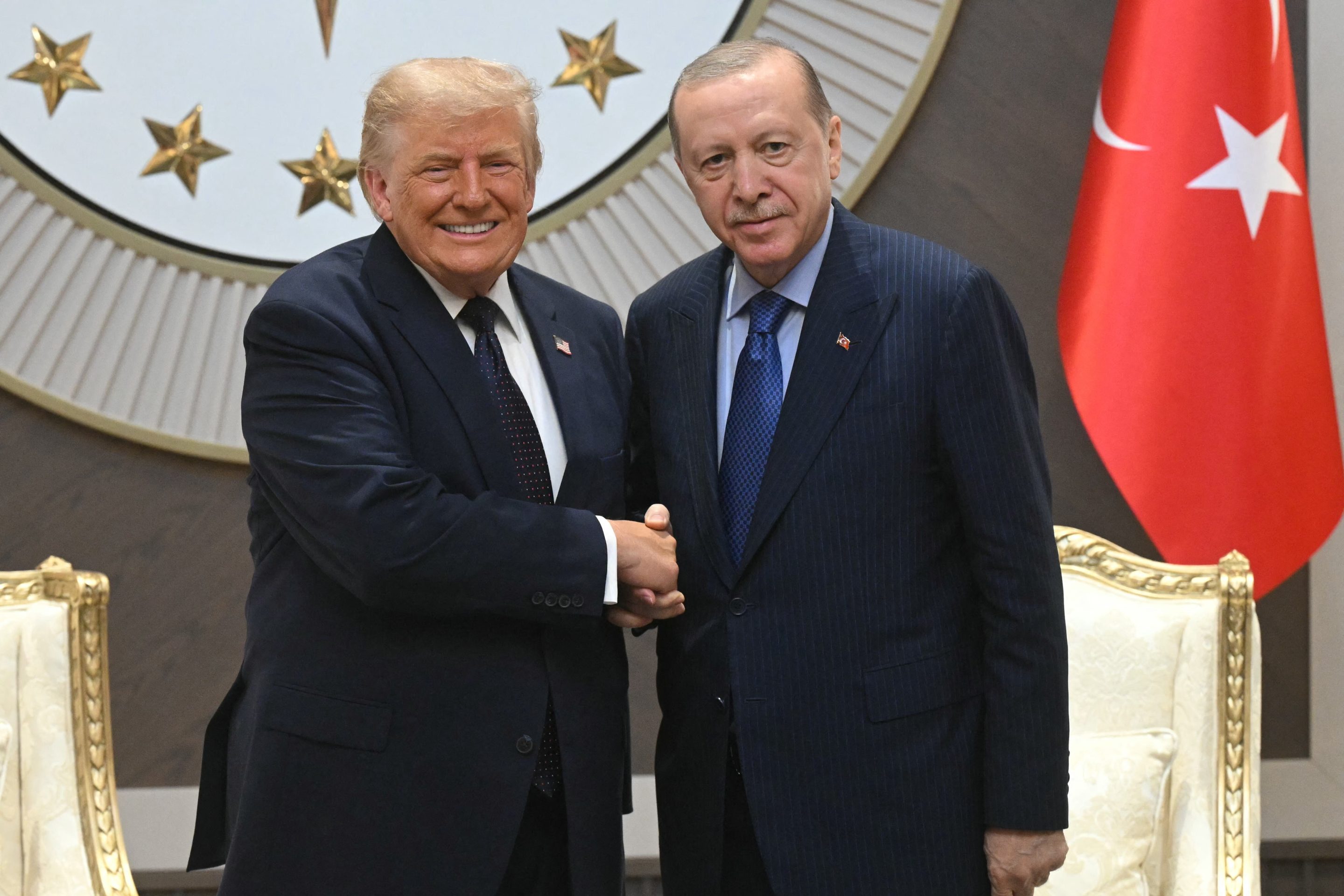 Turkish President Recep Tayyip Erdogan (R) shakes hands with US President Donald Trump (L) upon his arrival at Etimesgut Air Base near Ankara, on July 7, 2026, before attending the 36th NATO Heads of State and Government Summit.
