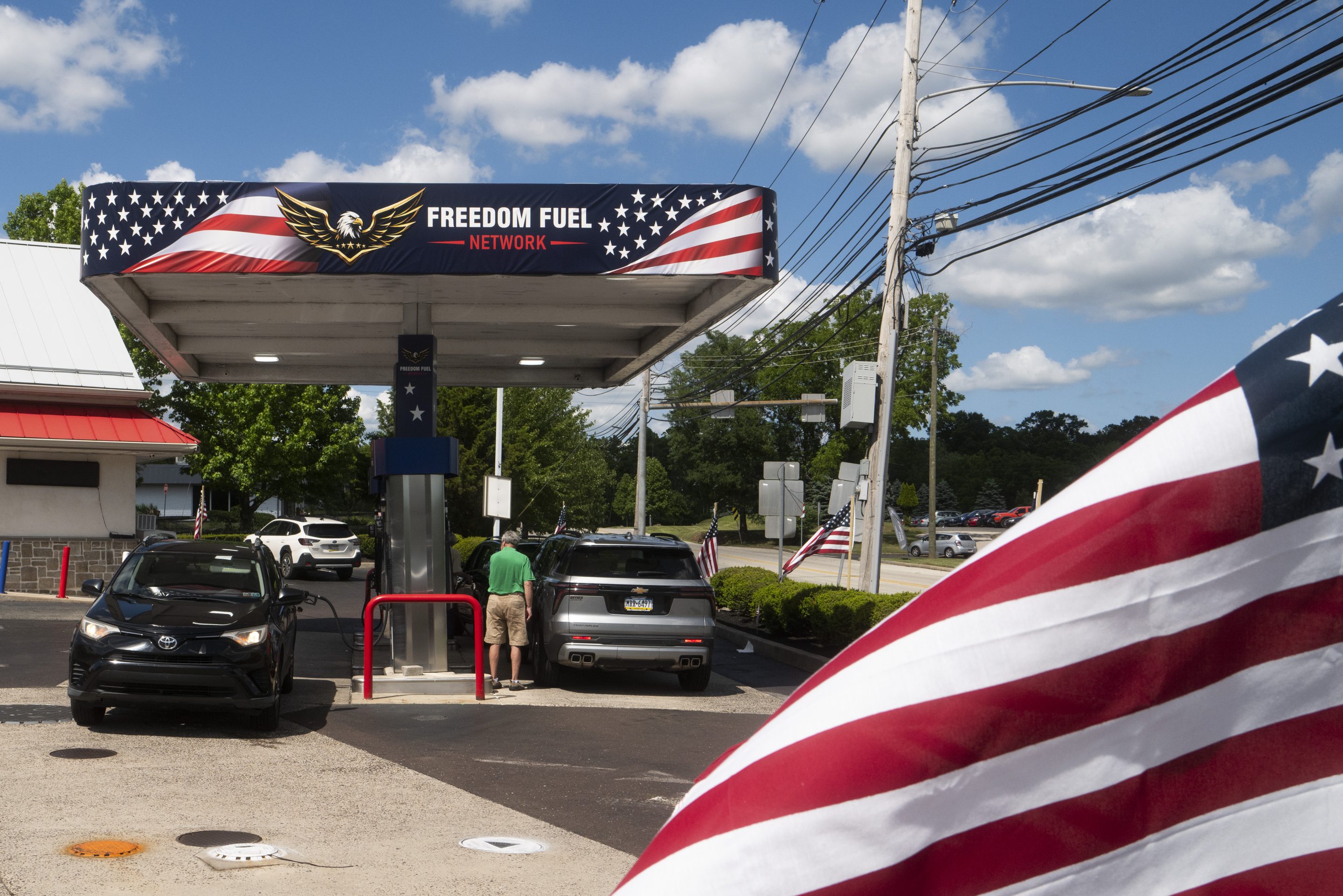 Customers pump gas at a Freedom Fuel Network station on July 8, 2026 in Dresher, Pennsylvania.