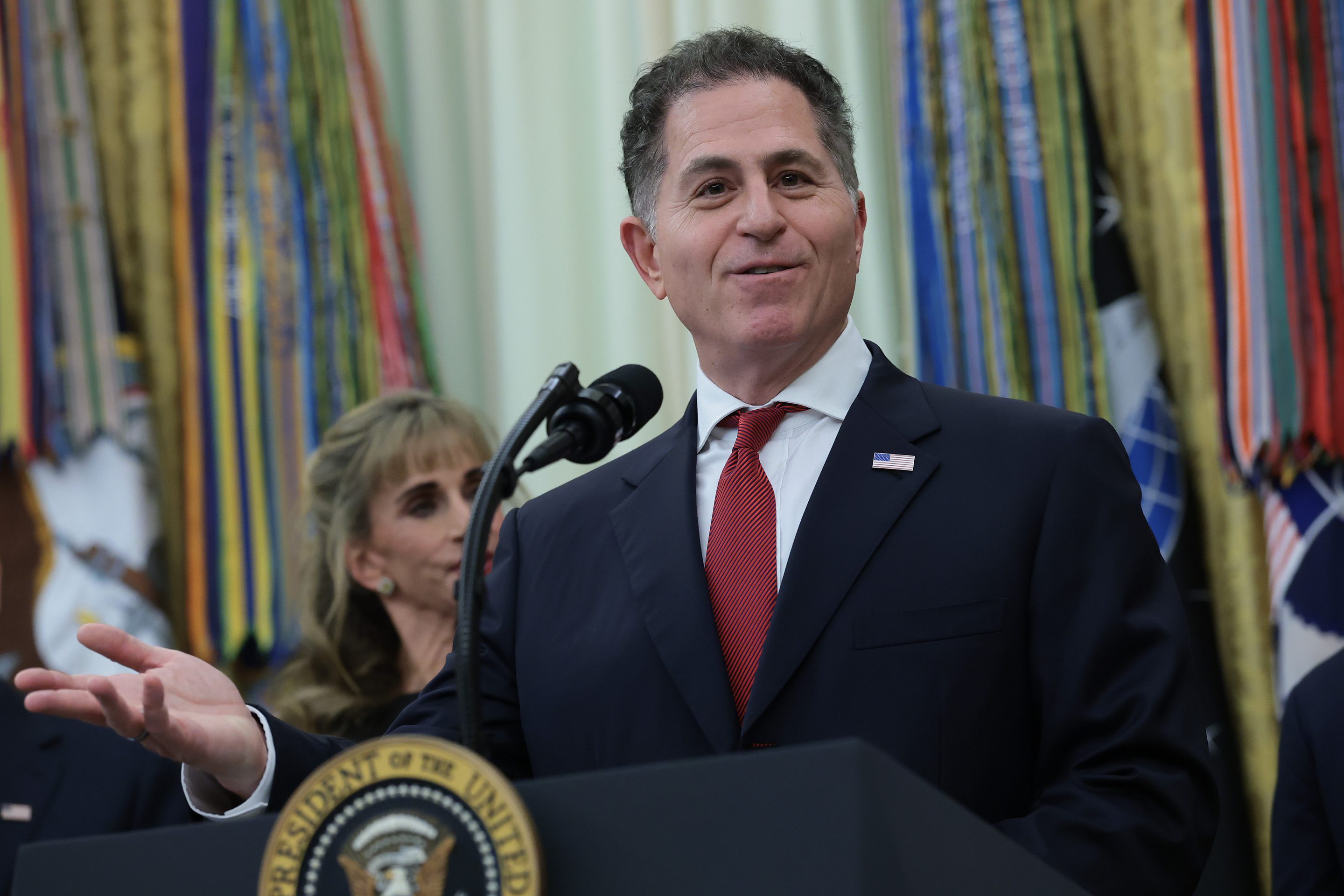 Tech billionaire Michael Dell speaks during an event to mark the first day of trading for "Trump Accounts" in the Oval Office at the White House on July 06, 2026.