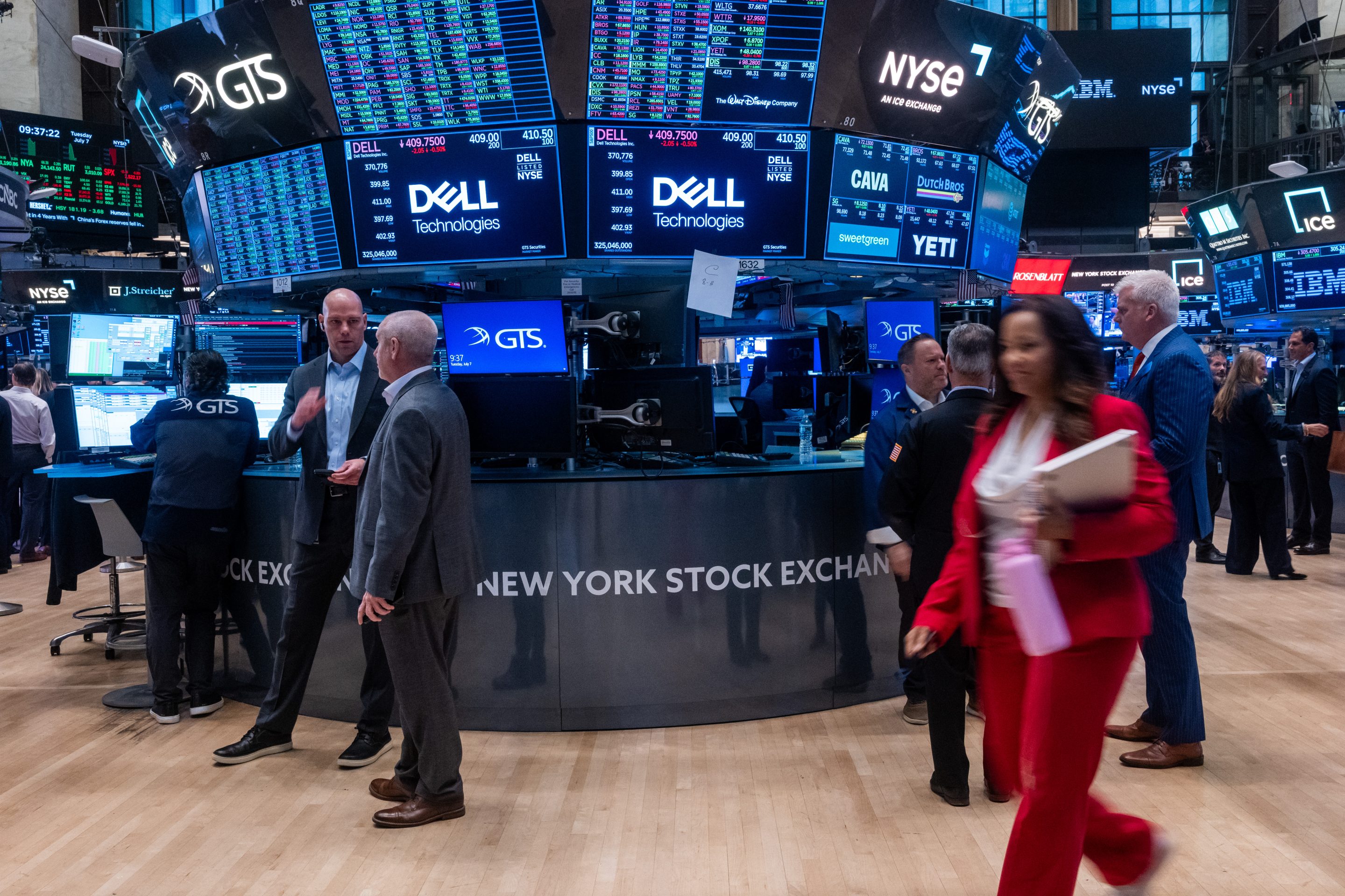 People work on the floor of the New York Stock Exchange (NYSE) on July 07, 2026 in New York City. The Dow was up slightly in morning trading after it closed Monday above 53,000 for the first time.