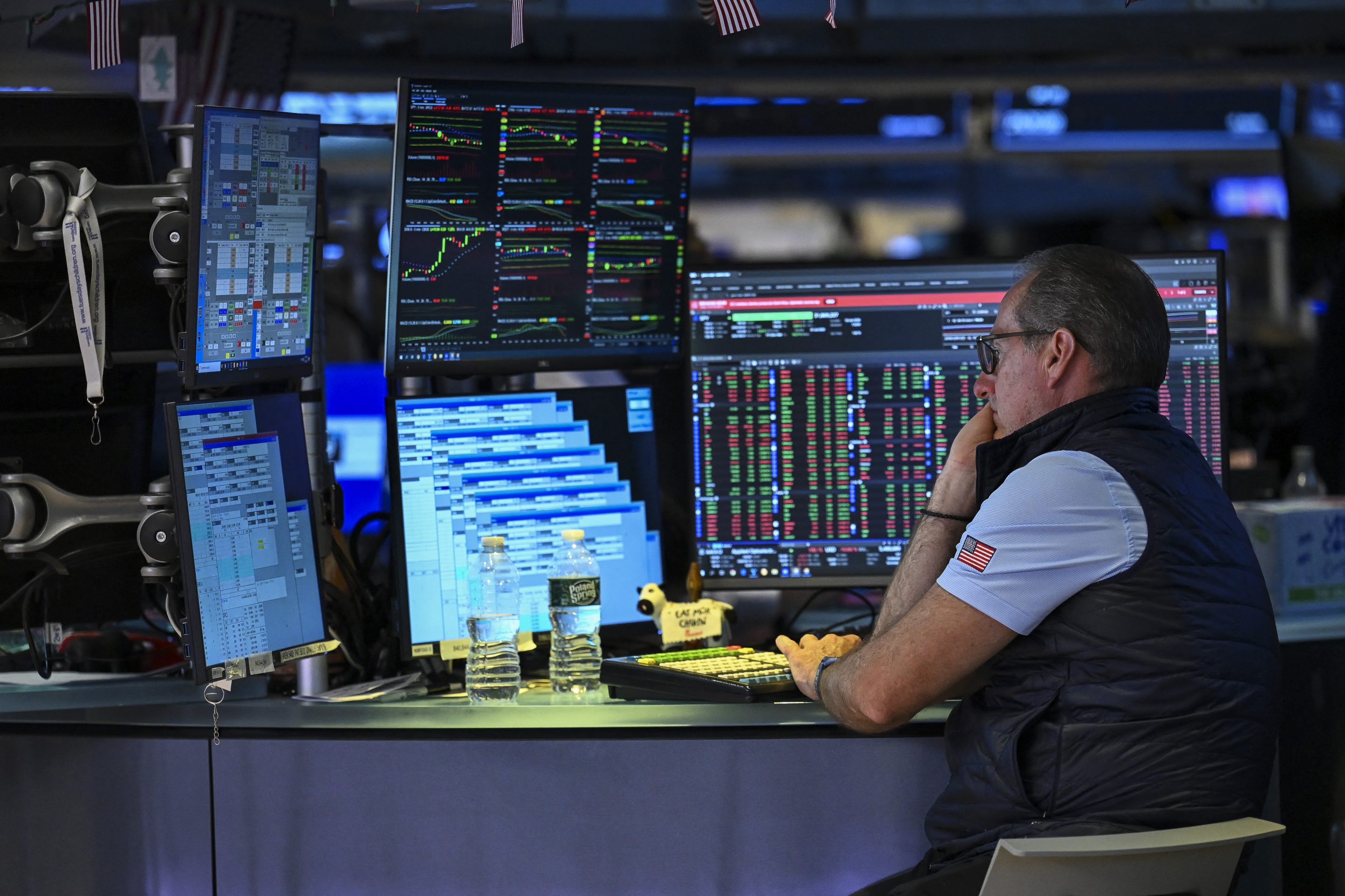 A trader works on the floor of the New York Stock Exchange (NYSE) on July 24, 2026 in New York. Oil prices surged past $100 a barrel on July 23 as Iran-backed Houthi rebels targeted Red Sea shipping as threats by US President Donald Trump to strike them in return sent equity markets slumping.