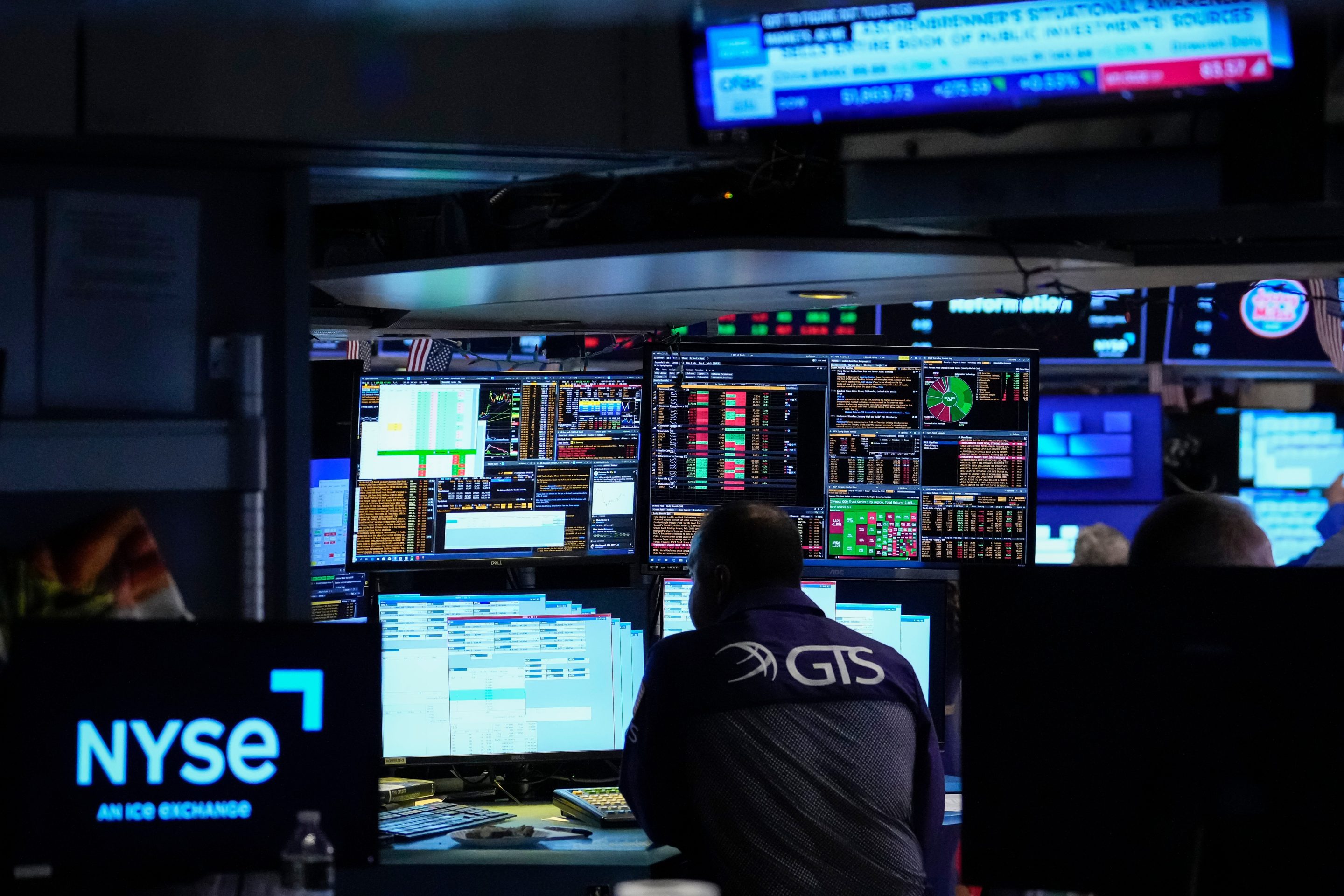 Specialist Dilip Patel works on the floor of the New York Stock Exchange.