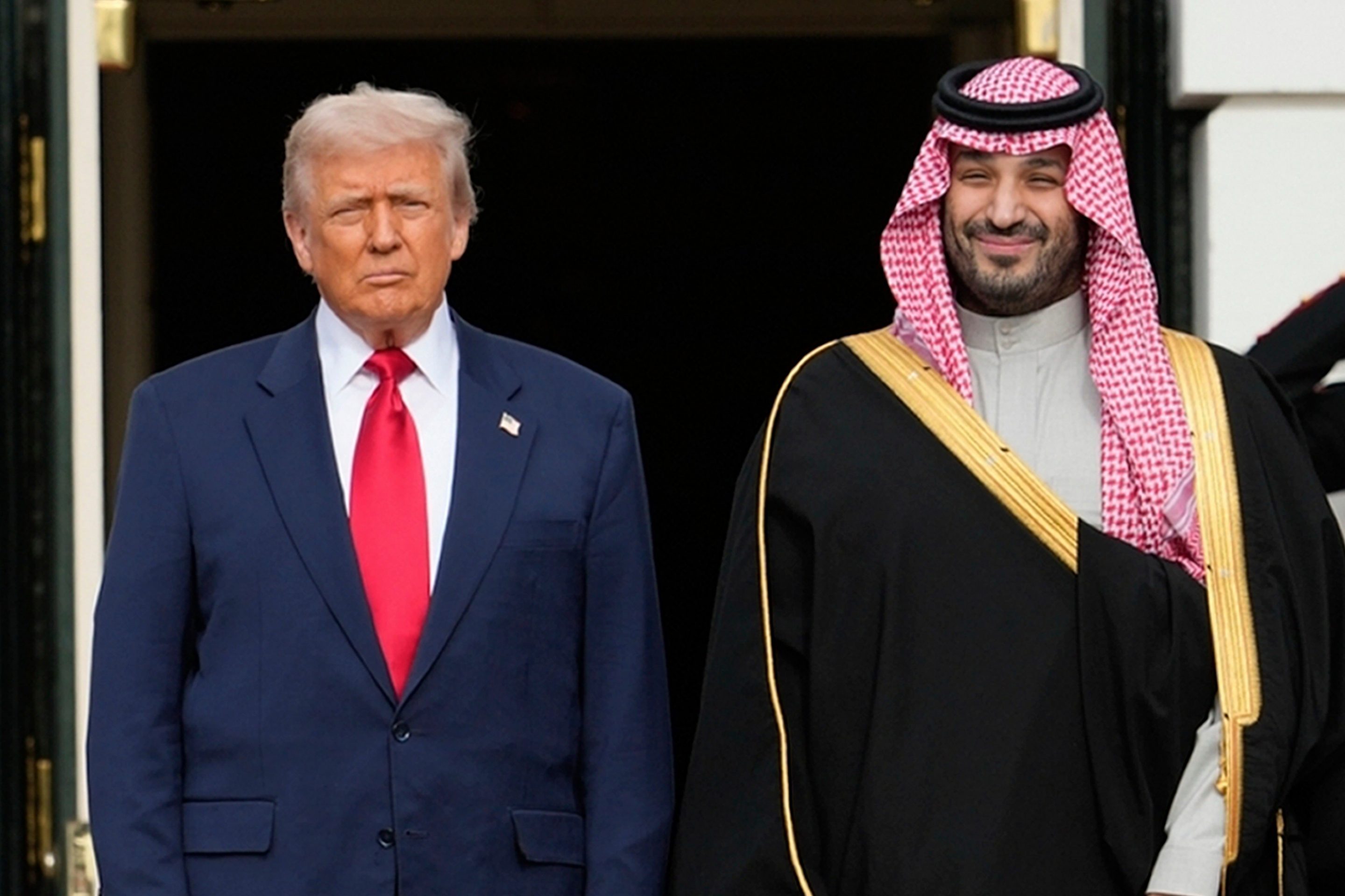 President Donald Trump stands with Saudi Arabia's Crown Prince Mohammed bin Salman on his visit to the White House on Nov. 18, 2025.
