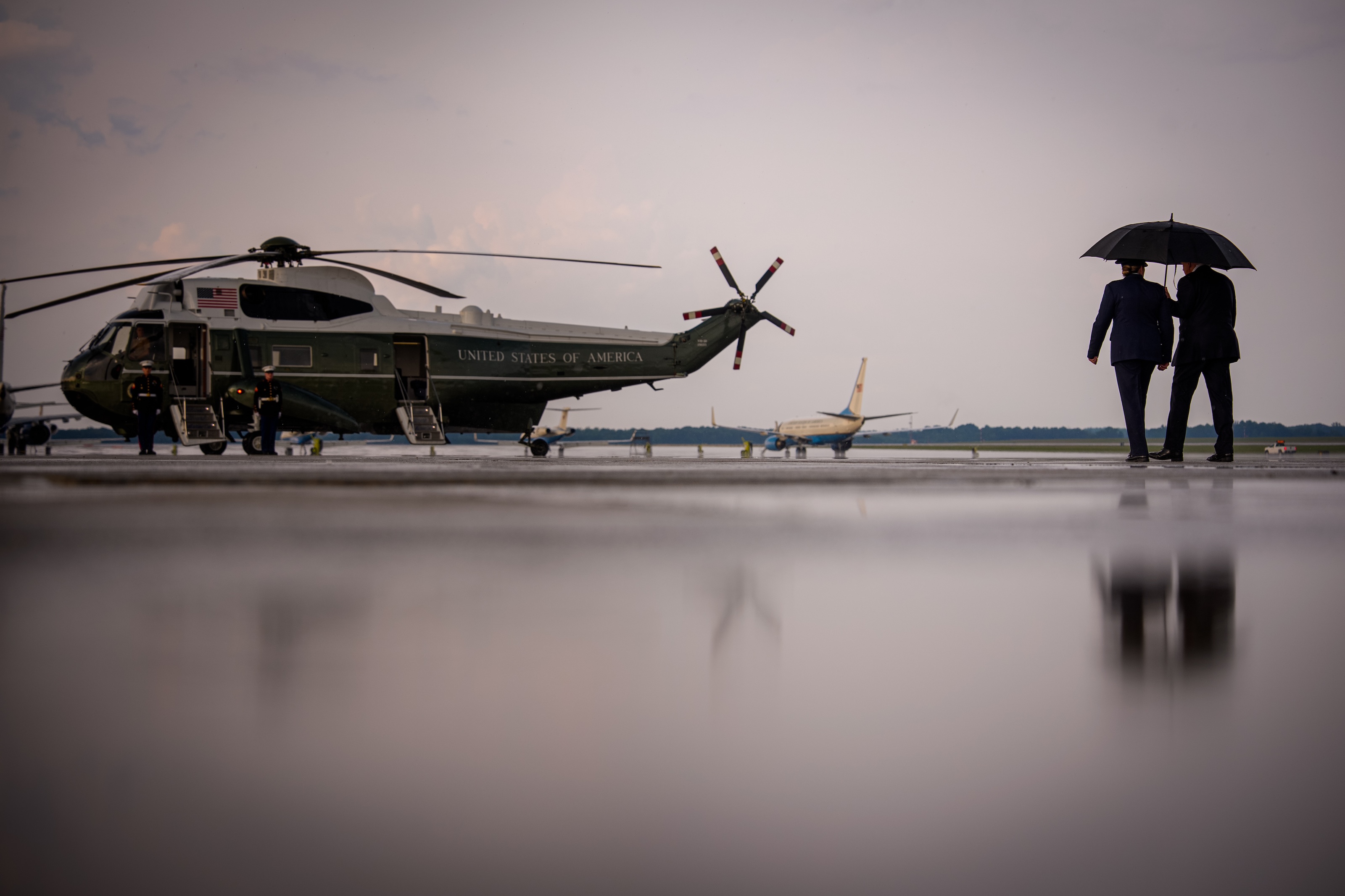 President Trump (R) walks towards Marine One for a short trip to the White House on July 27, 2026 at Joint Base Andrews, Maryland.
